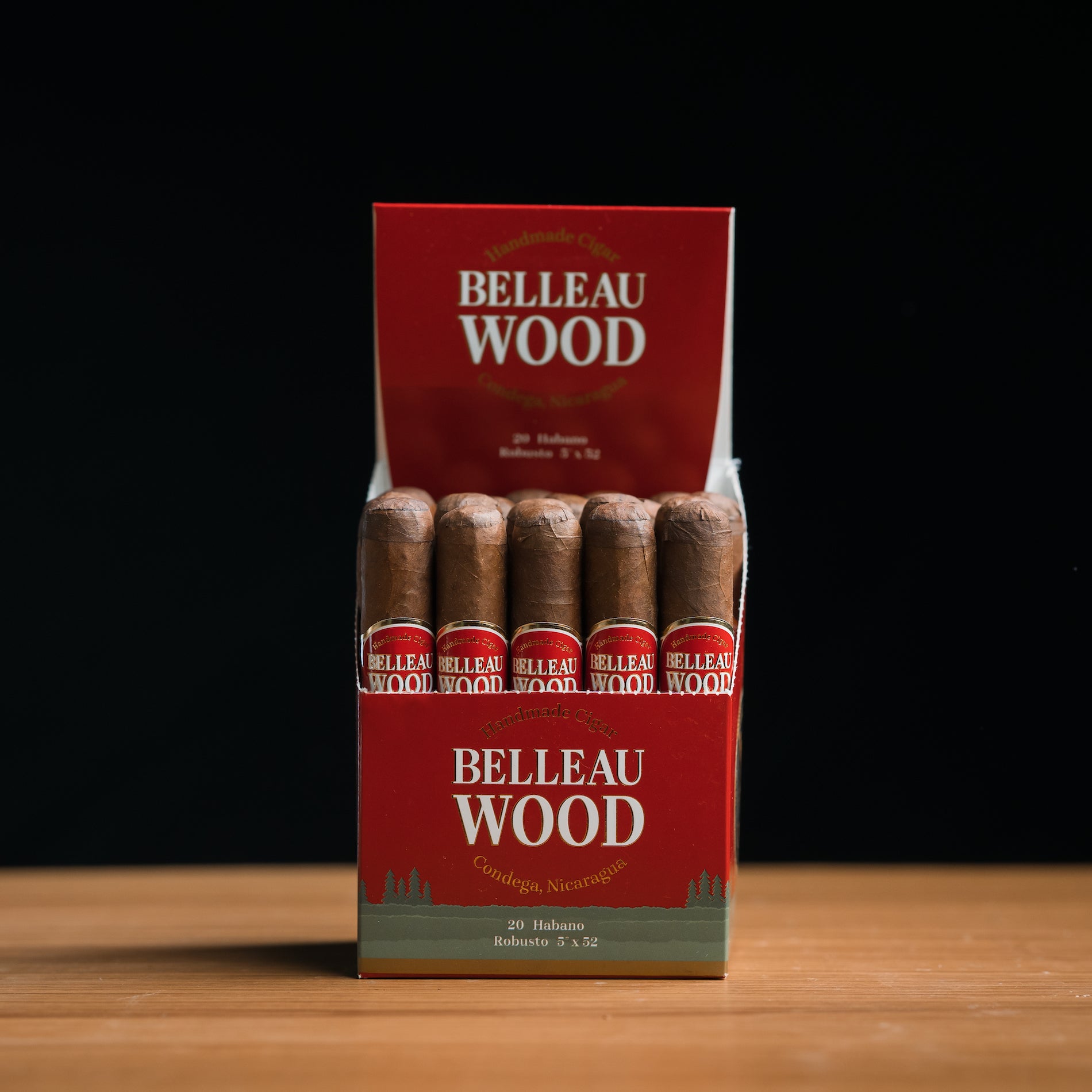 A box of Belleau Wood Habano robusto cigars, displaying multiple cigars with brown wrappers and red and white branding.